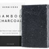 A handcrafted bar of Herbivore Bamboo Charcoal Cleansing Soap, featuring natural ingredients for deep cleansing and skin balancing.