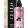 Crystal-infused Smashbox Primer Spray with rose quartz, amethyst, and black tourmaline for hydration and radiant skin.