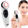 4-in-1 facial massager with ergonomic design, featuring ion therapy and red light technology for anti-aging and rejuvenation. 